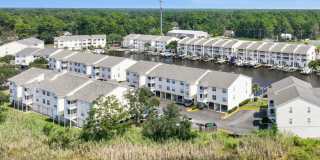 Welcome to Harbor Landing Condominiums — where coastal living meets convenience! Gallery 1
