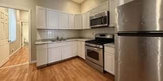 Charming 4BR/2BA Rowhouse with Hardwood-Style Flooring Throughout Gallery 9
