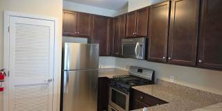 Beautiful 2nd floor (with elevator services) condominium: 2-bed, 2-bath, beautiful kitchen, bonus room, laundry room & deck! Gallery 10