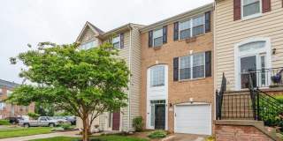 Spacious and sun filled townhome with a one car garage in the sought after Belmont Bay community. Gallery 1