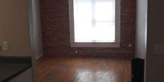 Large windows and exposed brick wall Gallery 8