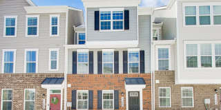 Welcome to this beautifully designed 3 level townhome in Westphalia Town Center Community! Gallery 1