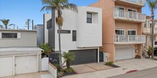 COMPLETELY REMODELED, BRIGHT  AIRY, TRI-LEVEL HOME W/ TOP-FLOOR GREAT ROOM LIVING SPACE, 2-CAR GARAGE, DECK  SPACIOUS PATIO/YARD JUST 2 BLOCKS TO BEACH! Gallery 1