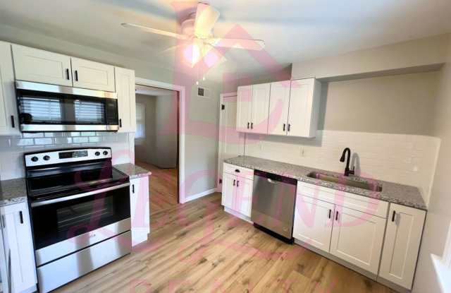 Updated 2-Bedroom Home with Bonus Room & Tuck-Under Garage Gallery 1