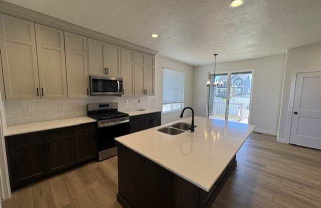 $1,750 OFF FIRST MONTH'S RENT! No Tricks, Just Treats! Spacious 4 Bed, 3 Bath Home in Farr West! Gallery 4