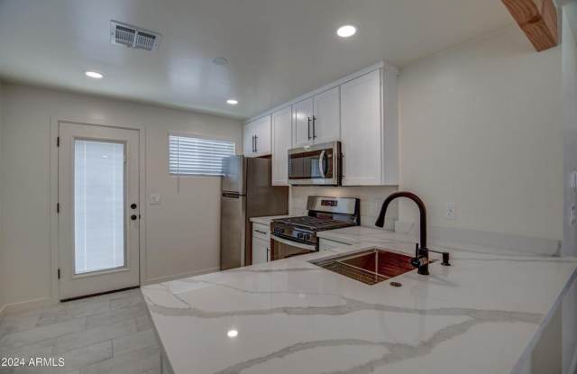 Stunning updated Townhome minutes to ASU campus available October 1st. 2 Bedroom, 1 bathroom completely updated with all appliances including washer and dryer in unit and your owner private yard.   Available October 1, 2026 photos photos
