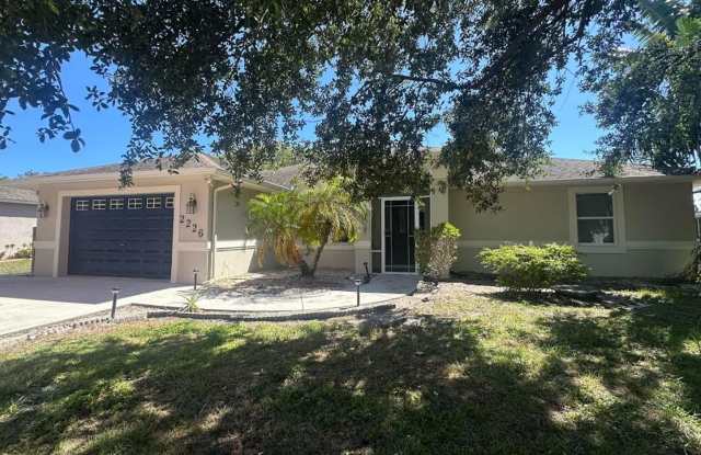 3/2/2 with patio -Just painted - Remodeled kitchen and new floors - 2226 Southeast Friendship Street, Port St. Lucie, FL 34952