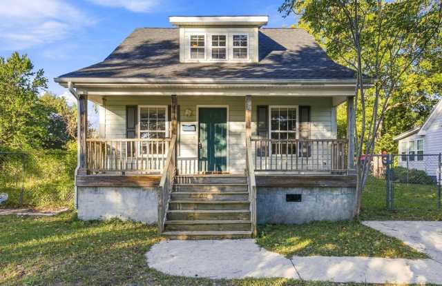 Updated Downtown Living with Bonus Den & Fenced Yard Gallery 1