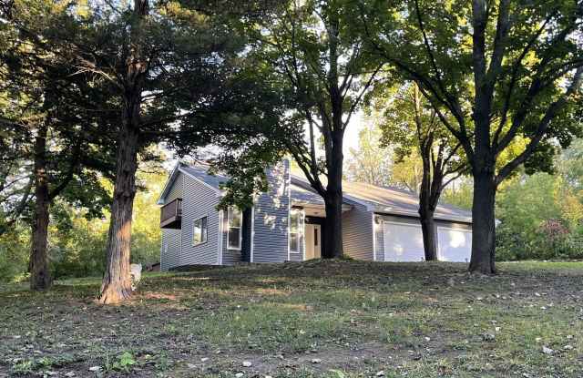 Newly Remodeled Estate Home on 5 Wooded Acres in the Middle of Plymouth!  2 Fireplaces, Vaults, Granite, More! Gallery 1