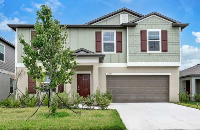 NEWER HOME! Two-story 4 bedroom 3 bath with screened Lanai located in Triple Creek community! photos photos