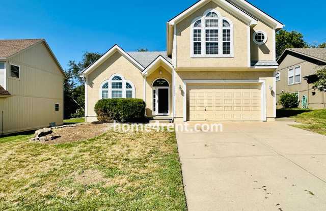 BRAND NEW CARPET/PAINT! Beautiful Home in Blue Valley Schools w/ Wood Floors, Finished Basement and a Peaceful, Private Fenced Yard! - 14236 West 153rd Street, Olathe, KS 66062