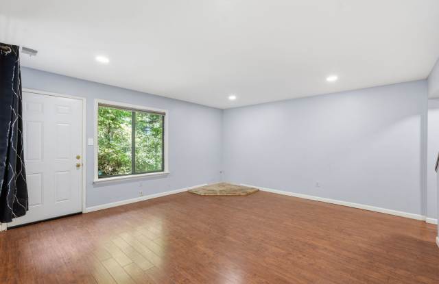 Tucked within the serene, tree lined setting of Covington, this contemporary townhome offers a refined sense of privacy paired with modern design. Gallery 3