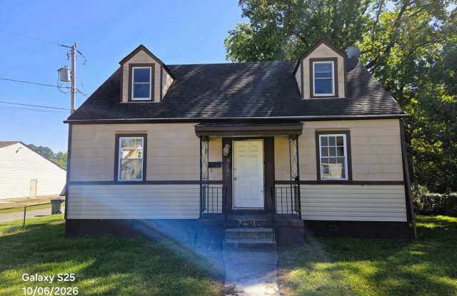 Cape Cod in Southside on large corner lot with private back yard. Gallery 1