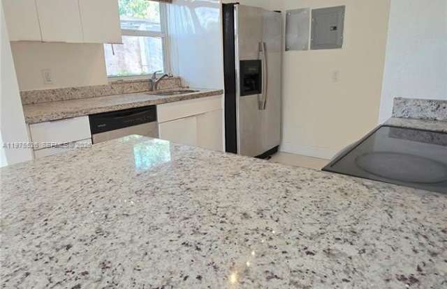 5715 NW 6th Ave photos photos