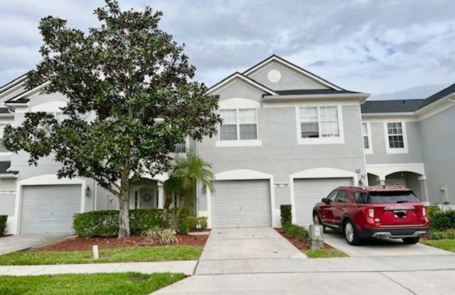 MOVE IN AUGUST! Beautiful 3 bed 2.5 bath townhome with large screened in back porch & 1 car attached garage!! In man gated Spring Isle/Avalon Park!! photos photos