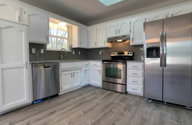Wow!  Everything is new!  3 bedrooms, 2.5 baths with a fenced backyard! Gallery 3