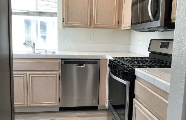 Upstairs condo in the Remington of Rancho San Diego with laundry a parking spot near all grades of school Gallery 3