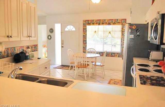 Bright and airy in beautiful gated community - lake views and Florida sunshine! Gallery 3