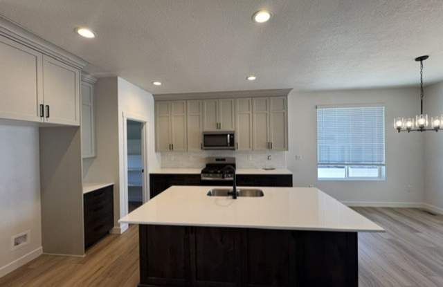 $1,750 OFF FIRST MONTH'S RENT! No Tricks, Just Treats! Spacious 4 Bed, 3 Bath Home in Farr West! Gallery 3