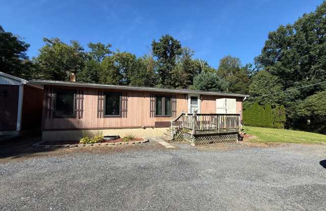 Set on over an acre in Saylorsburg, this 3-bedroom 2 bath Gallery 1