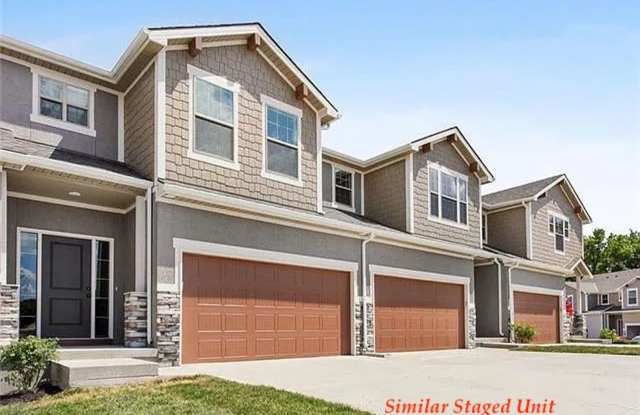 Stunning and Bright 3BR 2.5BA Townhome w/ 2-Car Garage • Quartzite Kitchen • Deck in Parkville photos photos