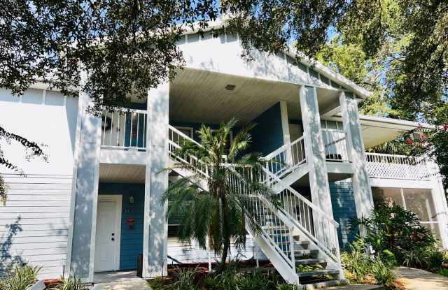 MOVE IN NOW!! NEW LAMINATE PLANK FLOORING & FRESH PAINT! Spacious 2nd floor- 2bd 2ba condo in gated community!! LARGE SCREENED IN BALCONY! Gallery 1