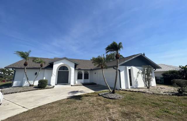 $1,875 ** ANNUAL ** Available 10/15/25 - Newly Renovated ** 3/2 Single Family Home with Oversized Lanai  Spa - 2092 Rio De Janeiro Avenue, Harbour Heights, FL 33983