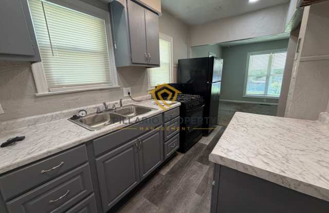 Charming 3-Bedroom Stone Bungalow with 2-Car Detached Garage & Fenced Yard, Available NOW! Gallery 3