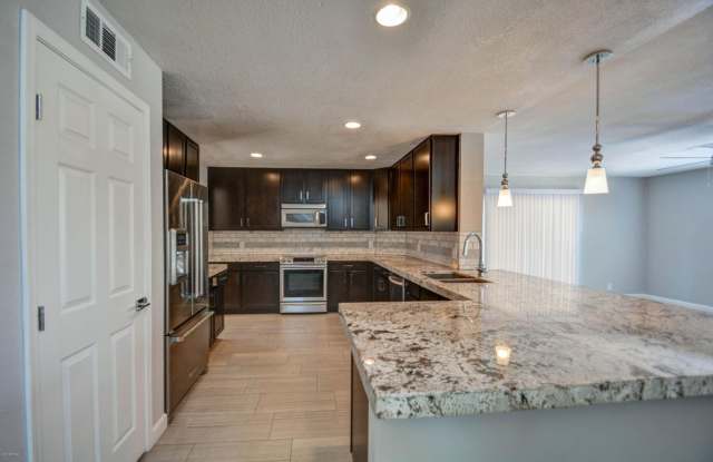 Offering 3 spacious bedrooms, 2.5 baths, living  family rooms, formal dining room, and 2 fireplaces. photos photos