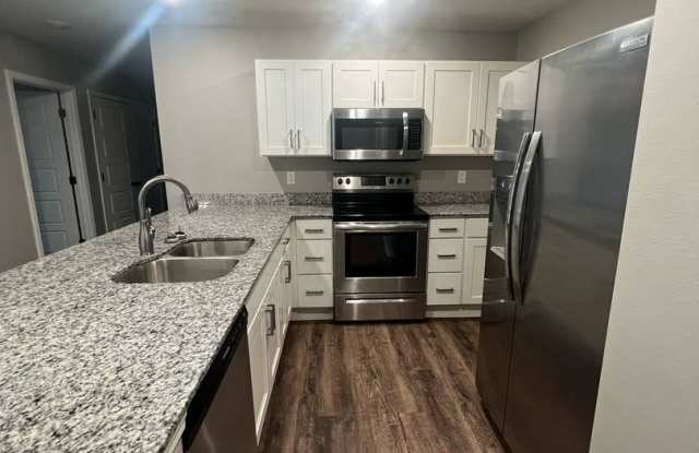 Newly built homes in Duenweg that have so much character! 3 bed/2 bath, one car garage, stainless steel appliances, covered back patio, and close to town! Gallery 4