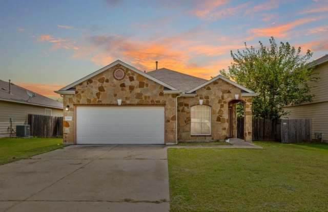 Open Floorpan is Move in Ready just for you! Wood look laminate and Tile run throughout the home with carpet only in the bedrooms. - 2009 Blewett Drive, Hutto, TX 78634