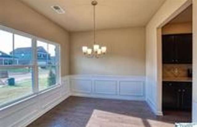 COMING SOON! Welcome to the Carlyle—where classic brick farmhouse charm meets a sleek, modern lifestyle! Gallery 3