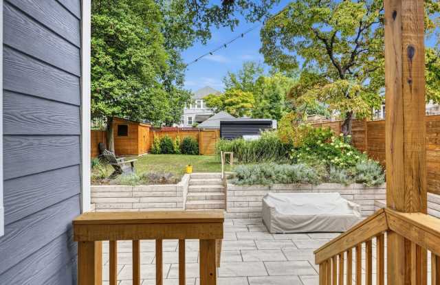 GORGEOUS Federal SFH w/EXQUISITE Backyard featuring large Flagstone Patio & Private Driveway w/EV Charger! Gallery 4