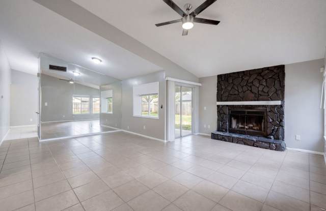 Freshly painted, spacious, 3bdm/2ba home with fireplace and laminate flooring throughout. Gallery 4