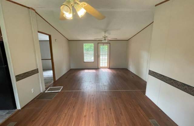 Looking for Acreage? This updated 3 bed, 2 bath home with an inside laundry room sits on 1.5 Acres of land. photos photos