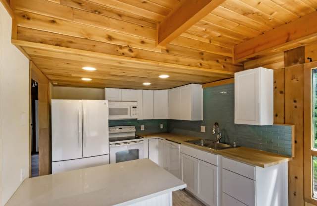 On an acre in Palmer! 4 bedrooms/3 bathrooms Oversized 2car garage PLUS additional shop! Additional kitchen and separate entrance on ground floor! photos photos