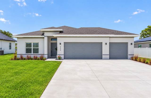 Stunning Nearly New 4-Bedroom Home in Cape Coral – 3-Car Garage, Luxury Upgrades & Modern Living! Gallery 1