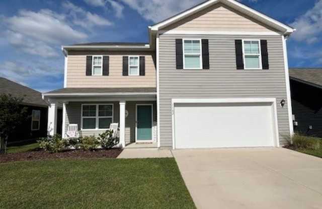Discover this spacious 4-bedroom, 2.5-bath home in Winnabow, NC photos photos