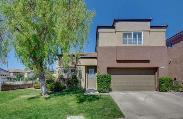 Situated on a beautifully landscaped oversized corner lot within the gated community of Desert Bloom in the heart of Summerlin photos photos