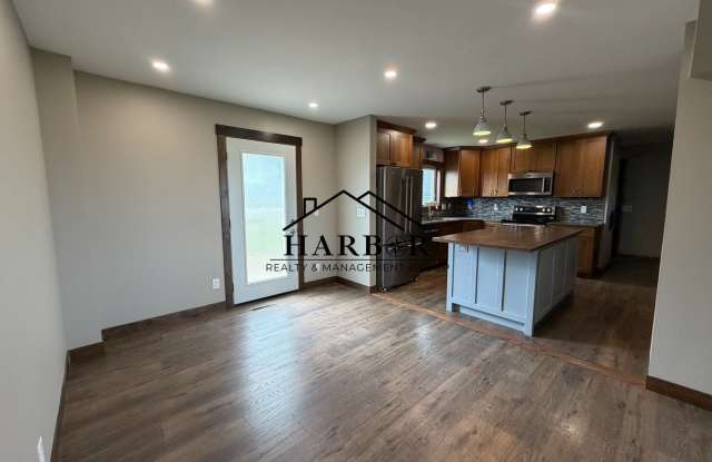 *First Months Rent Free* Spacious 3BR Home with 2-Stall Garage & Private Deck in Kasson Gallery 3