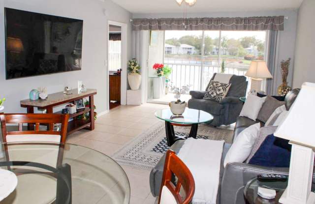 ***BERKSHIRE LAKES***NEW REMODELED MASTER BATH***STUNNING LAKE/BRIDGE VIEW***END UNIT*** photos photos