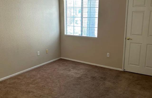 Spacious single-story, ground-level corner unit located in a desirable gated community. Gallery 4