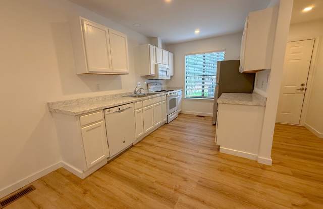 Welcome to this beautifully updated 2-bedroom, 2.5-bath lakeside condo in the highly sought-after Oaks of Avent Ferry community. Gallery 4