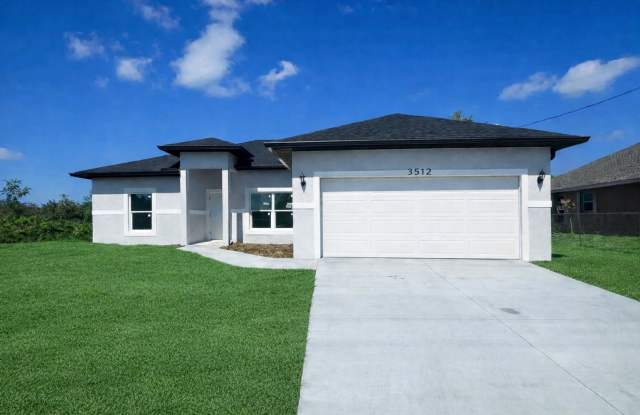 JUST BUILT! 4 Bed / 2 Bath Home with 2 Car Garage- In Desirable SW Lehigh Acres Location - 3512 20th Street Southwest, Lehigh Acres, FL 33976