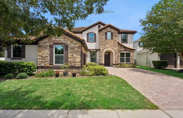 This spacious and charming 7-bedroom, 4.5-bathroom single-family home is located at 8701 Iron Mountain Trail Windermere, Florida 34786 photos photos