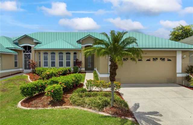 UNFURNISHED ANNUAL RENTAL IN PUNTA GORDA ISLES ON A GOLF COURSE WITH COMMUNITY POOL AND CLUBHOUSE - 1519 Atares Drive, Punta Gorda, FL 33950