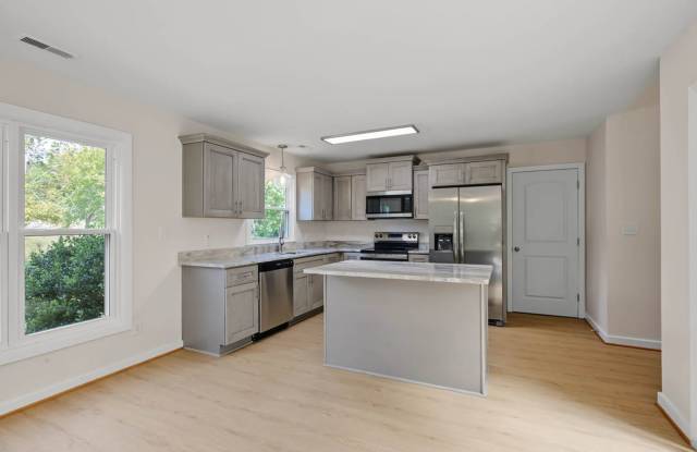 Impeccably Renovated Seaford Home next to water way with Skylit Atrium & Spacious Yard Gallery 3