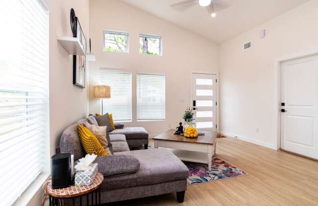 Spacious Fully Furnished 3BR/3BA home in a quiet neighborhood near downtown and beaches, featuring private baths, outdoor seating areas, fenced yard, and modern comforts—perfect for short or long-term stays. Gallery 4