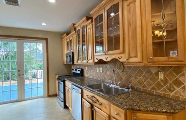 Beautifully renovated and restored 1925 Mediterranean Spanish-style single-family home featuring 2 bedrooms, 1 bathroom, plus a separate office with French doors. Gallery 4
