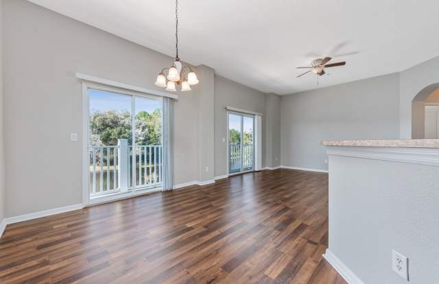 WAKE UP TO PEACEFUL LAKE VIEWS in this spacious 2-bedroom, 2-bath condo with an attached 1-car garage in the desirable East Park community near Lake Nona Gallery 3
